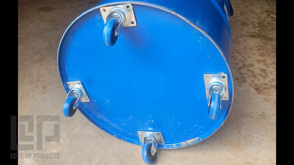 Bottom of garbage can with magnets holding caster wheels